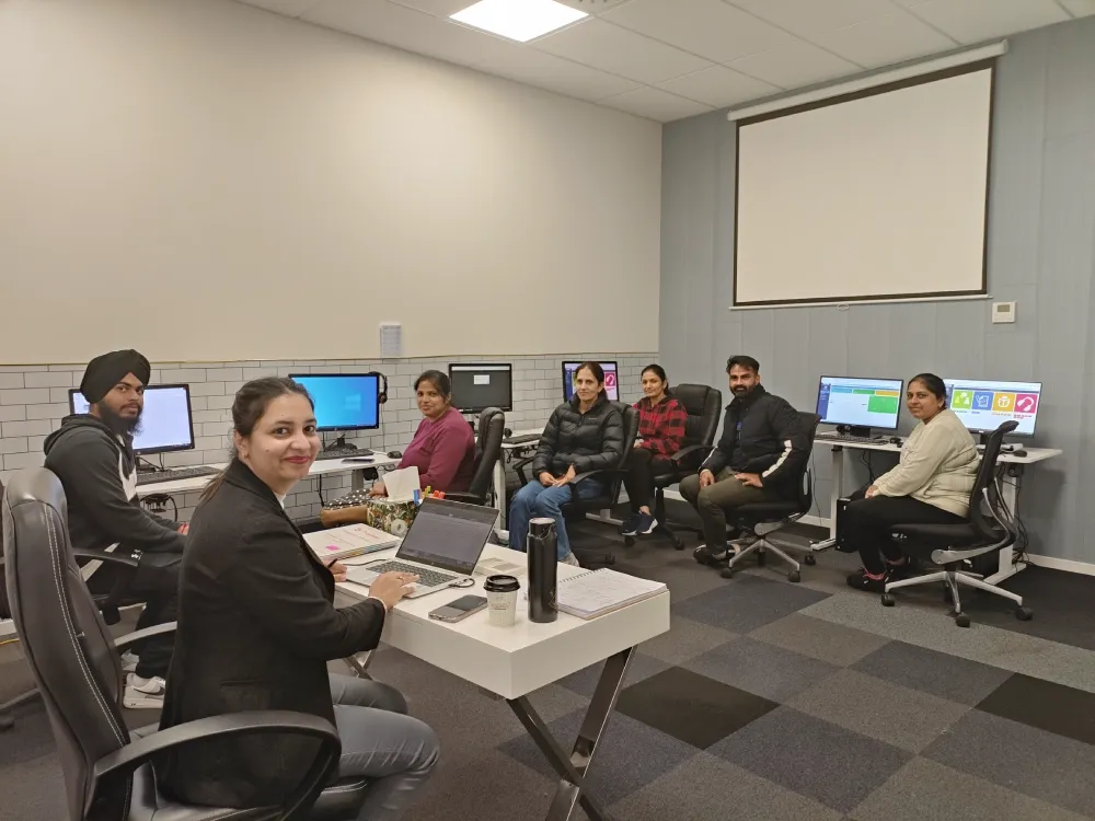 Students practising on the PTE exam simulator computers at Target Language Academy